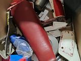 a cardboard box filled with assorted items in it
