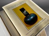 a picture of a book with a picture of a vase on it