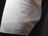 a close up of a label on a black jacket