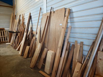 many pieces of wood leaning against a wall