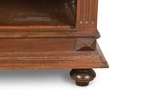 a wooden cabinet with a glass door on top of it