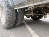 a close up view of a truck tire on the road