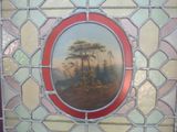 a picture of a picture of a landscape in a stained glass window