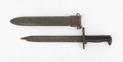 pair of old and rusty knifes on a white surface
