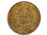 an old gold coin on a white surface with a white background
