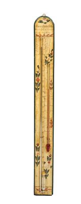 un grand thermomètre orné d'un motif floral