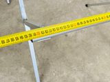 a measuring tape on the floor next to a table