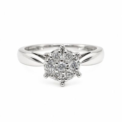 a close up of a diamond ring on a white background
