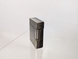 an image of a lighter sitting on top of a glass table