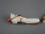 a banana and banana peel on a string