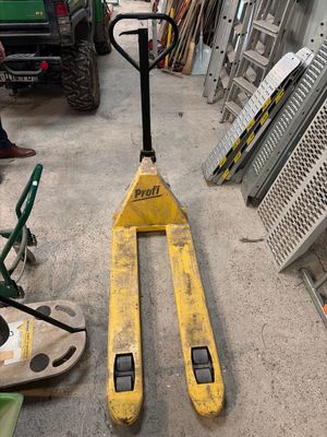 a forklift that is sitting in a garage
