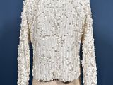 a close up of a mannequin mannequin with a white jacket on it