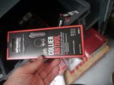 a person holding a box with a gun inside of it