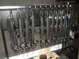 a picture of a bunch of knives hanging on a rack
