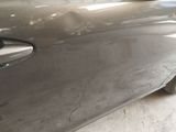 a close up of a car door handle with a sticker on it