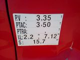 a close up of a sign on a red car