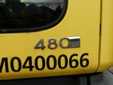 a close up of a yellow truck with a number on it