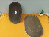 two oval trays sitting on a yellow table cloth