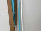 a picture of a room with a ladder and a box on the floor