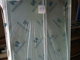 a refrigerator that is wrapped in plastic and sitting on the floor
