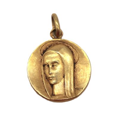 a close up of a gold medal with a woman ' s face on it