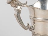 an antique silver cup with a handle and a handle on it