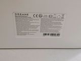 the back of a white refrigerator freezer sitting on top of a counter