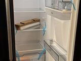 an open refrigerator with the door open in a kitchen