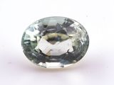 an image of a green and white gemstone on a white surface