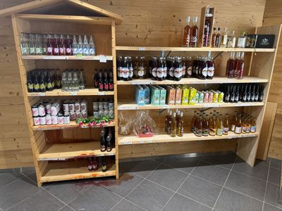 a wooden shelf filled with bottles and bottles of alcohol