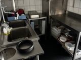 a small kitchen with a sink and a microwave in it