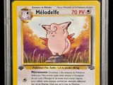 a close up of a pokemon card with a pig on it