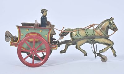 une figurine représentant un cheval tirant une calèche avec un homme à bord