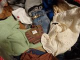 a suitcase full of clothes and a handbag full of clothes