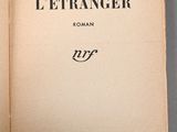 an open book with a picture of a man on the cover