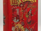 un livre rouge sur lequel figurent un clown et d'autres personnages