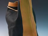 black and tan leather bag with a tan leather strap
