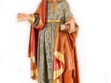 statue of a man with a beard and a robe on a white background