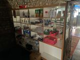a room with a lot of items on the shelves