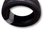 a close up of a tire on a white background with a tag