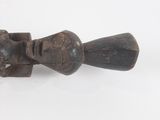 an old wooden pipe with a handle on a white surface