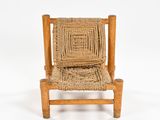 chair made of wood and wicker with a woven seat and back