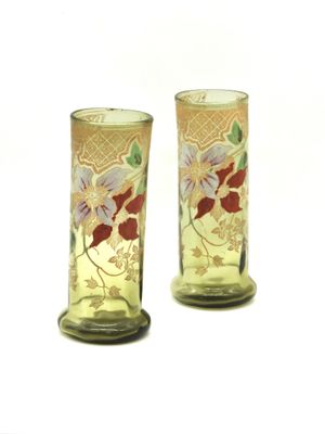 two vases that have been decorated with flowers on them