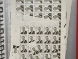 a lot of stamps on the pages of a binder