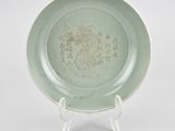 chinese celade plate with a dragon design on the rim
