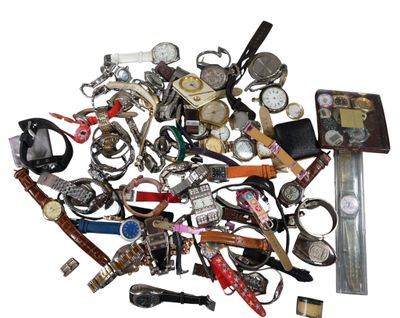 a pile of assorted watches on a white surface