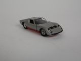 a toy car that is sitting on a white surface