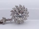 an image of a close up of a diamond necklace on a white surface