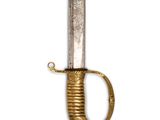 a close up of a sword with a gold handle on a white background