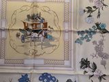 a picture of a table cloth with a picture of a horse drawn carriage